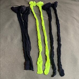 3 pairs of fishnet stockings. 2 black & 1 yellow. Never worn. See pics for size